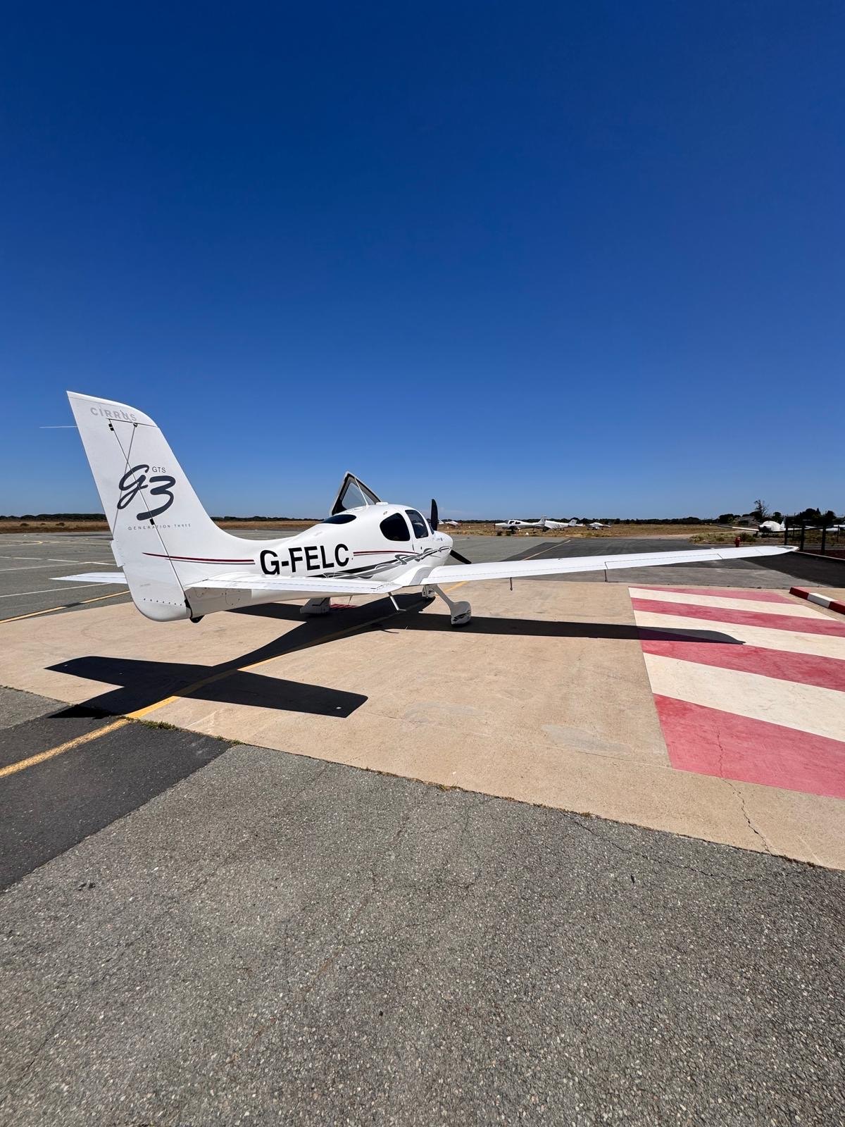 Cirrus SR22 G3 G-FELC parked on a sunny apron